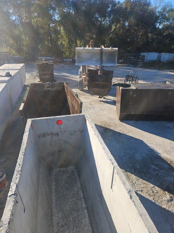 Precast concrete septic tank being cast in a heavy steel form at the Bonded Septic manufacturing yard