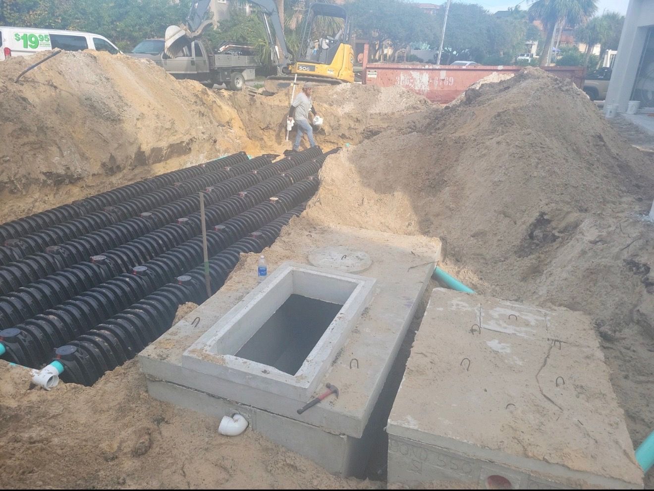 Precast tank and layered distribution chambers installed for a nitrogen reducing septic system