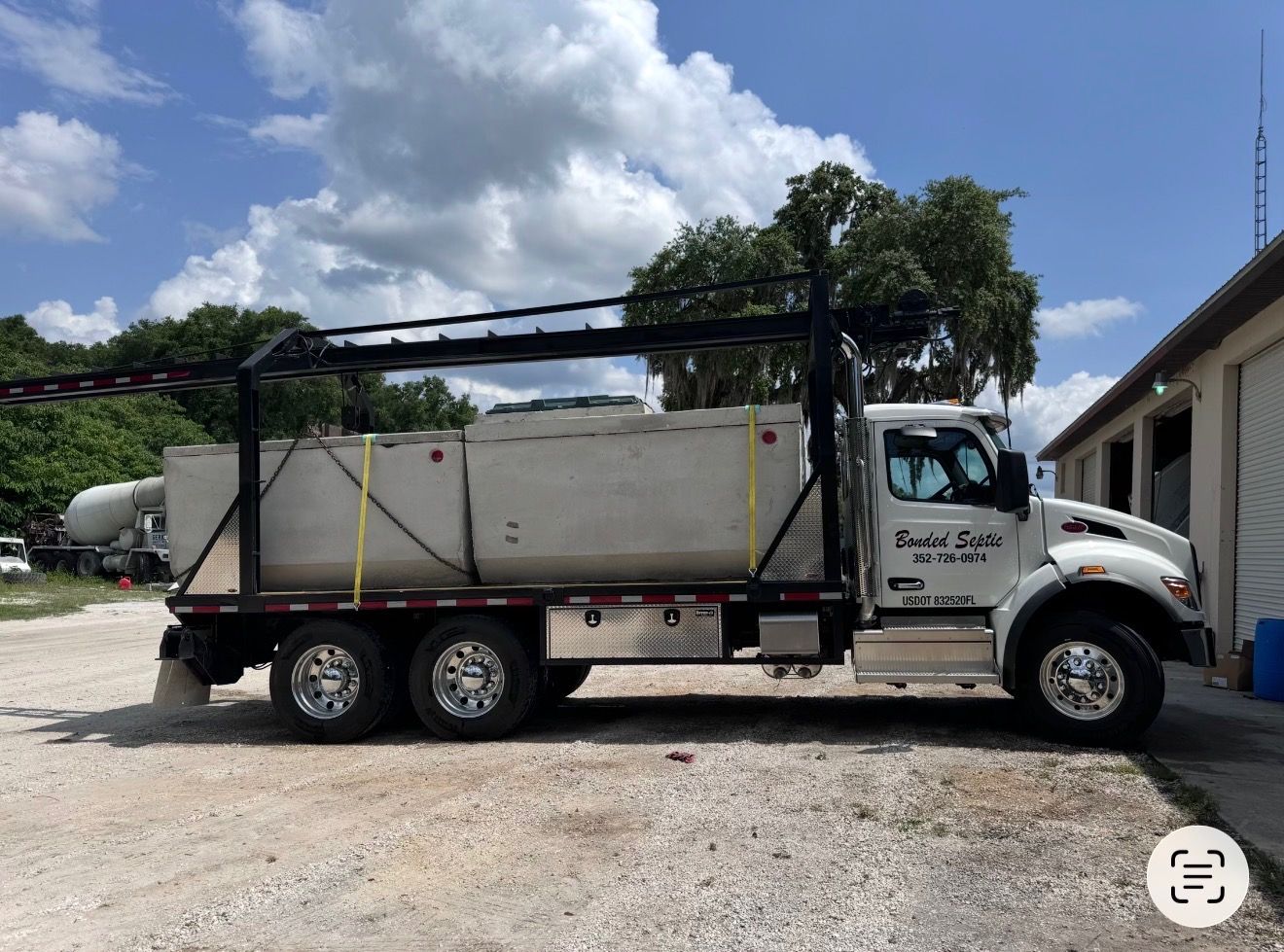 Precast concrete septic tank set in place and ready for connection